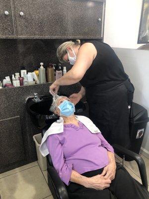 My mom getting her hair washed with Alina.