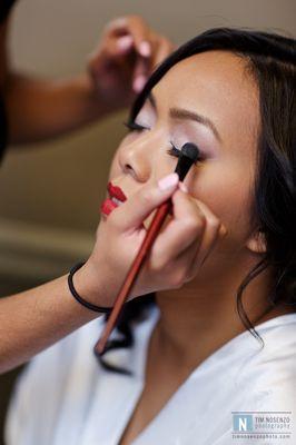 our bride Sandara getting her makeup done for her special day