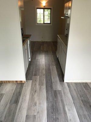 New kitchen cabinet installation with new flooring