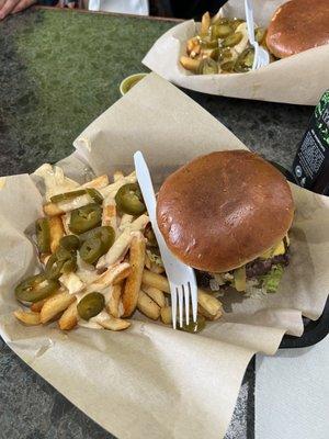 Punk burger with queso fries and jalapeños.