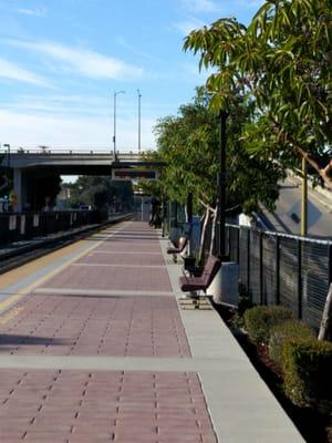 Gimmie shelter...no, seriously, it's effin hot out. Southbound platform; covered seating area on northern end.