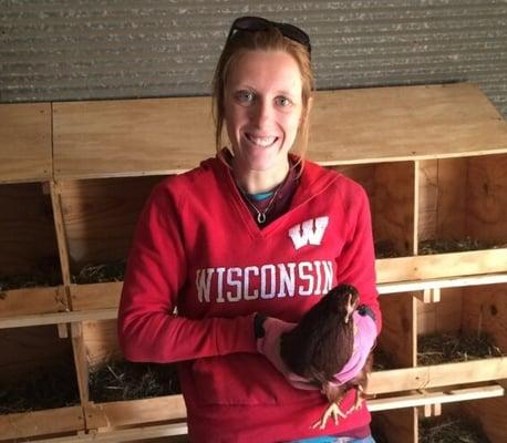 Bridget handling one of our Rhode Island Red hens.  We are looking forward to getting some eggs from these ladies soon!