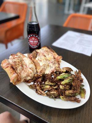 Chicken parmigiana hero with fried Brussels sprouts