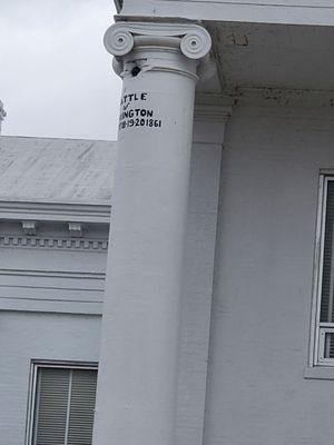 There is a cannon ball trapped in the building across the street. This is a civil war cannon ball.