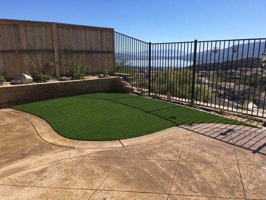 Stamped concrete with artificial turf