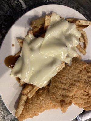 Chicken finger fries basket. French fries have gravy and cheese on them.