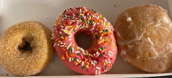 Cake, pink frosting with sprinkles, raspberry filled