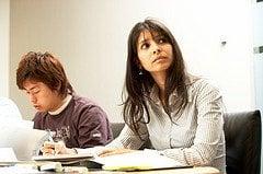 A Veritas Prep GMAT student listens to her expert instructor