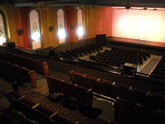 View of stage and auditorium featuring 1928 peacocks and roses.