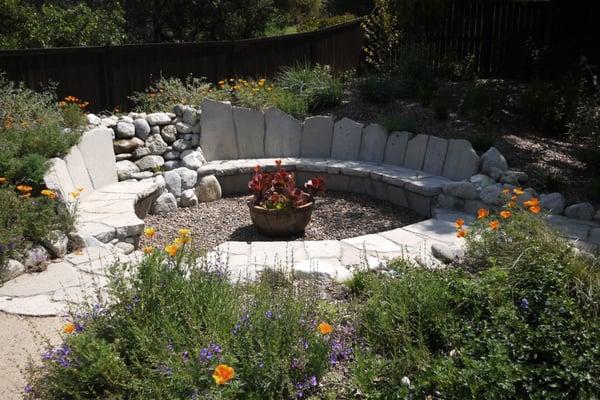 Broken concrete bench with fountain.