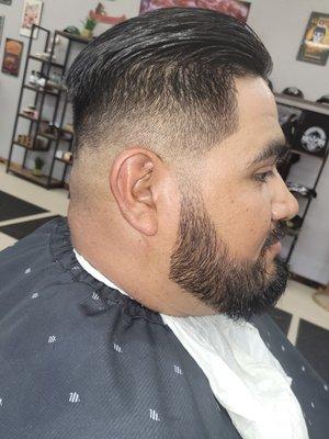 Medium high slick back, straight razor beard trim