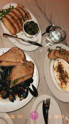 Stracciatella toasted crushed pistachios, olive oil, honey, sea salt. Mussels' tomatoes, calabrian, lemon, garlic, white wine, herbs, toast