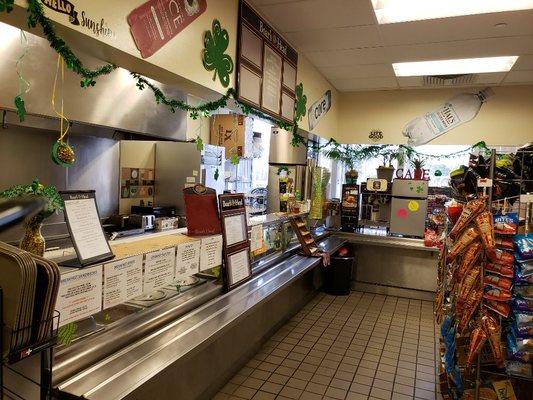 Order counter decorated  for saint patty's day. As the cafe is seasonally decorated.