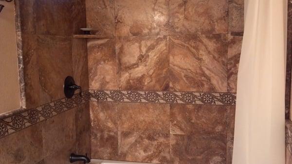 Travertine tub surround and wainscot