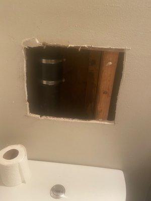 Holes in the wall made by maintenance and left