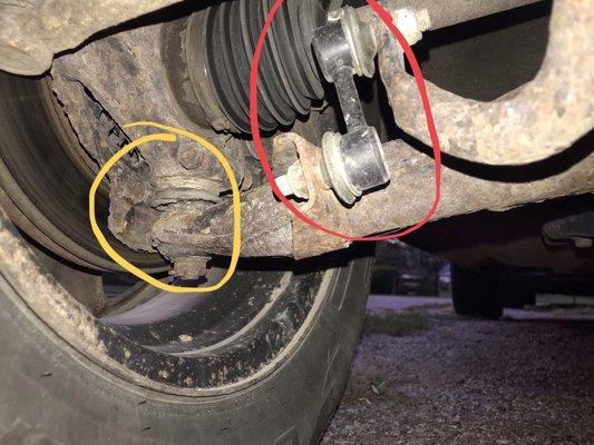 Circled in red is the easy replacement part installed,  Circled Yellow- control arm that clearly needed replacement.