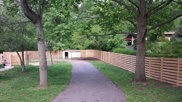 6 foot horizontal cedar board fence with 2 inch space