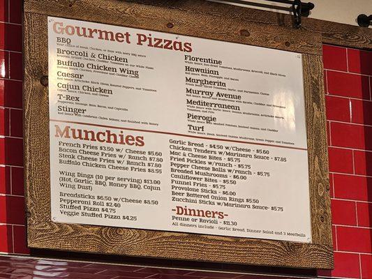 Gourmet Pizza/Munchies/Dinners Menu above counter.