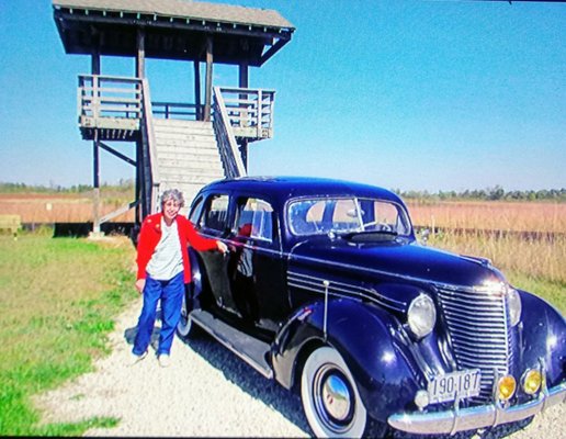 Rita Rinelli and '38 Hupmobile 822E at a Ranger tower.