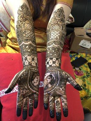 Good job ! henna art on  bridal hands