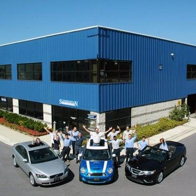 Scandinavian's staff in front of our building with a few of our cars