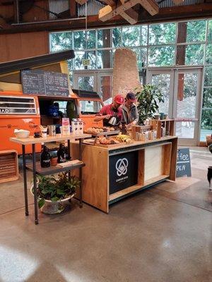 Coffee stand inside of REI, by front door.