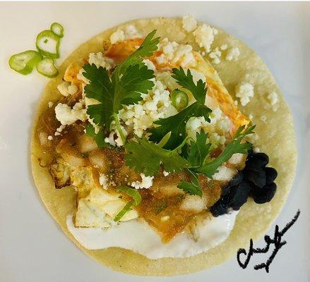 What a Treat Sunny up cage free egg medium smothered with a mild med or hot Salsa Brazil w/black beans, scallions & cilantro - Enjoy! Chef V