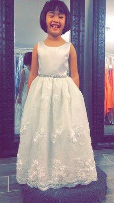 My niece trying on her flower girl dresses