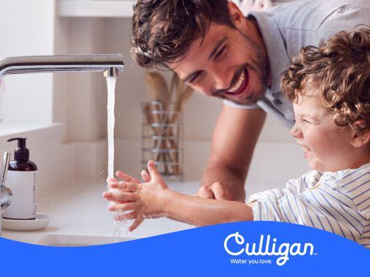 Father and Son at Sink with Culligan Water