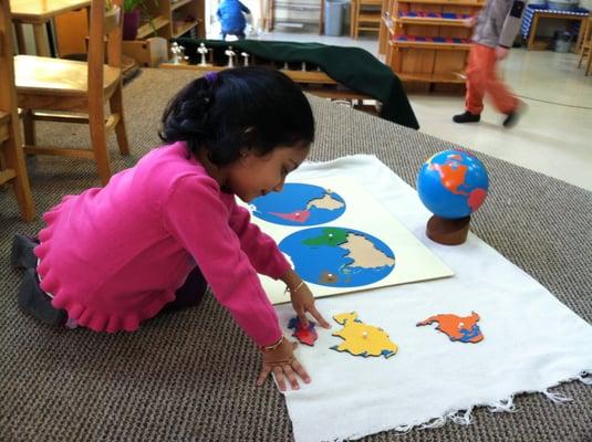 Alta Vista Montessori Student working on maps.