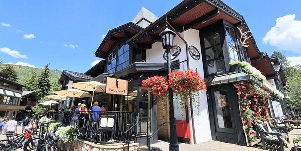 The building. So beautiful! There are so many beautiful corners like this in Vail. Bike racks outside the restaurant on the left.