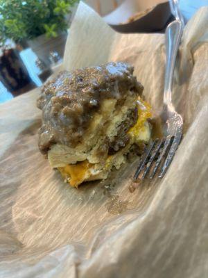 "The Ultimate" sausage egg and cheese breakfast sandwich on buttermilk biscuits loaded with homemade sausage gravy.