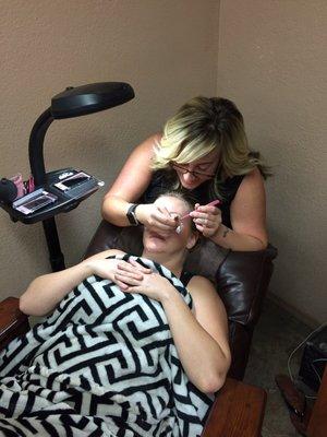 Brittney applying eyelash extensions