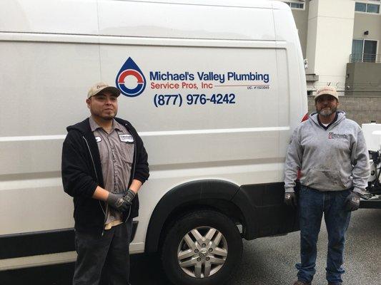 Michael and one of his crew members at his truck.