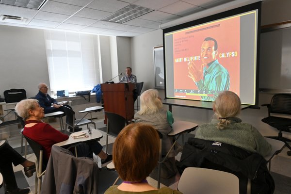 During a class on Harry Belafonte, students listen to a recording --and some sing along. Photo: Carl Glassman/Tribeca Trib