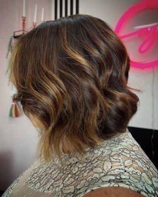 Perfect, slightly angled cut with layers and beautiful looking sun kissed color