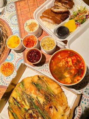 Korean Pancake, soft tofu soup with pork dumplings and tonkatsu.