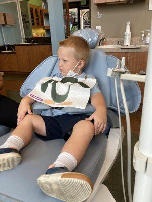 Setting up my 2yo for his teeth brush and check up. Friendly staff helps him feel at ease.