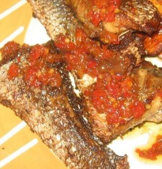 Grilled Croaker Fish, Sauteed in Spicy Seasoned Tomatoes Sauce.