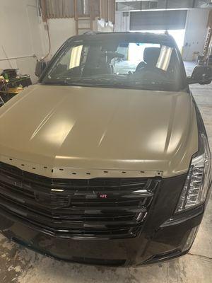 New hood on this Escalade, ready to go to the bodyshop.