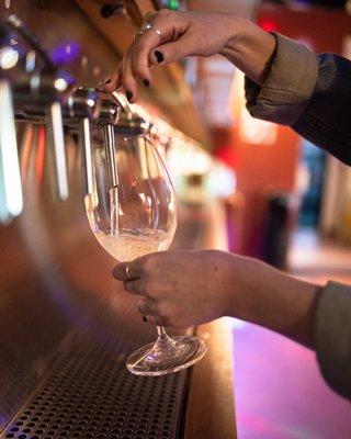 A self-pour tap wall with upwards of 56 wines from around the world!