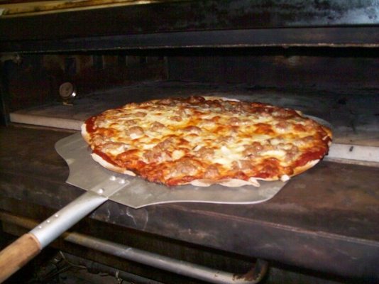 Our stone pizza oven dates back to the 1950's and still makes the best pies!