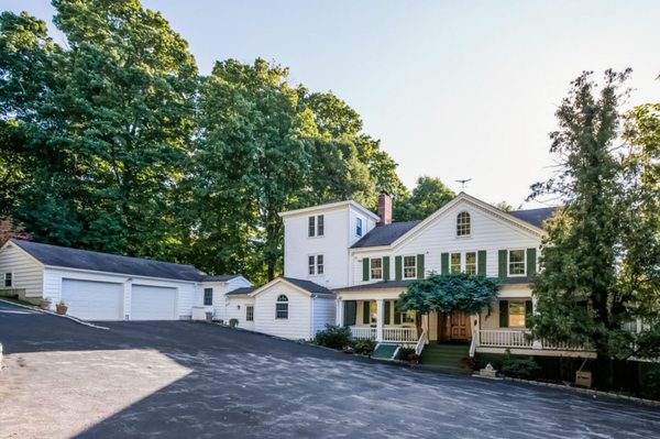 Completed Briarcliff Addition: Garage and indoor connecting hallway from kitchen area on historic house, matching details of existing home.