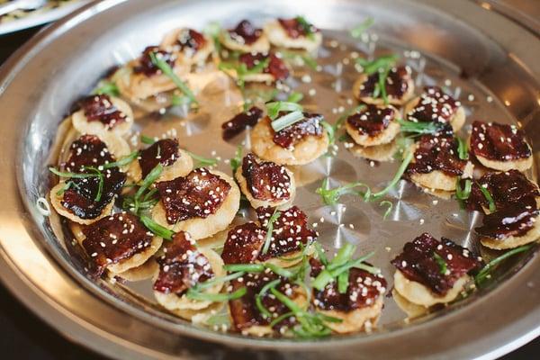 Delicious hoison glazed bacon bites on won-ton rounds with scallions!!!