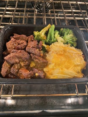 BBQ beef tips with potatoes gratin and broccoli