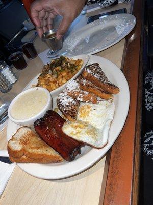 Full breakfast with French toast, eggs, potatoes, grits and hot polish sausage. Well done!