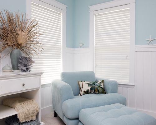 The simplicity of white faux woods  enhances the room