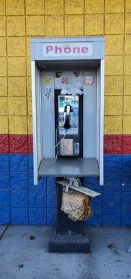 A real working coin-op phone booth with phone book!