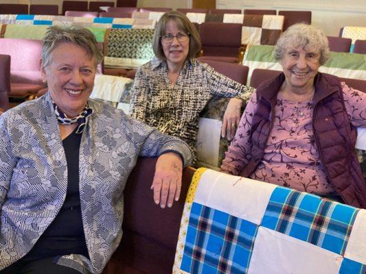 Comfort Makers and some of the quilts donated to relief efforts