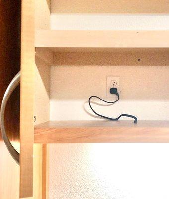 Easily accessible switched duplex outlets hidden behind cabinet doors